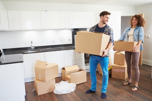 Team using protective equipment during a furniture move