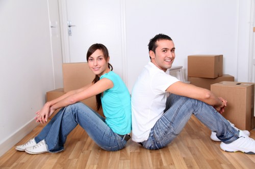 Professional movers handling boxes and furniture for a local relocation