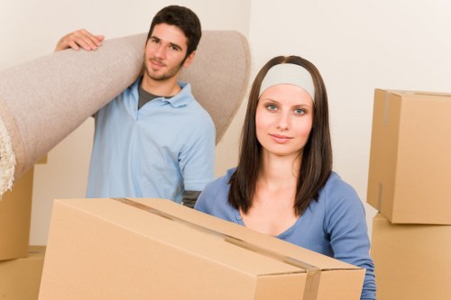 Local moving team preparing boxes in a Kingston upon Thames property