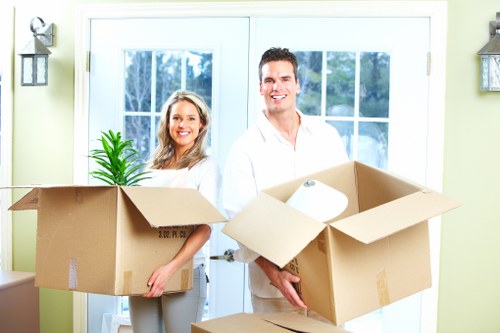 Packed boxes and furniture being loaded for a local home removal