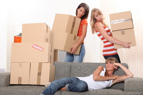 Packed moving boxes and furniture ready for transport