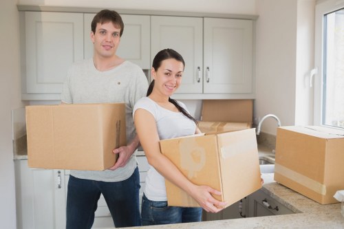 Professional movers handling boxes and furniture in Kingston upon Thames
